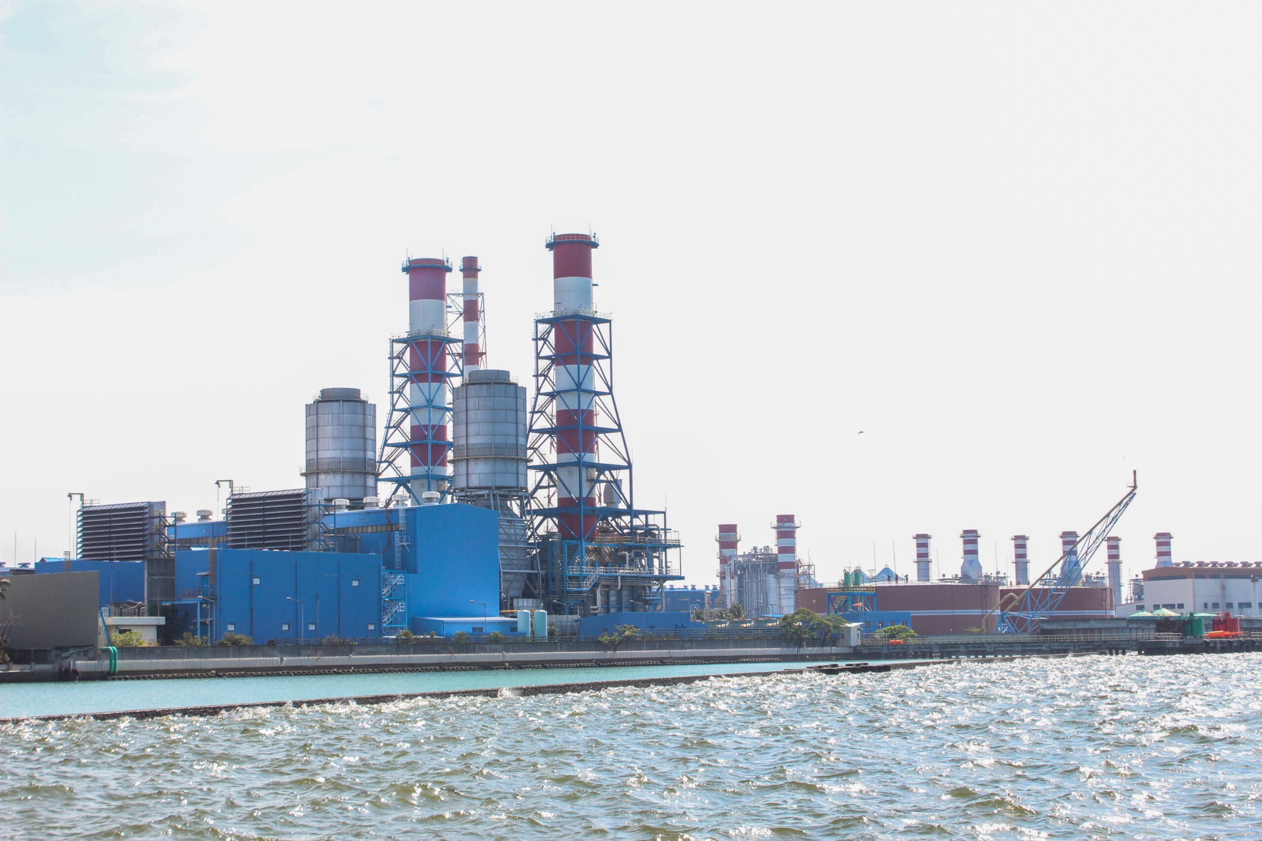 large-industrial-plant-with-blue-sky-white-clouds
