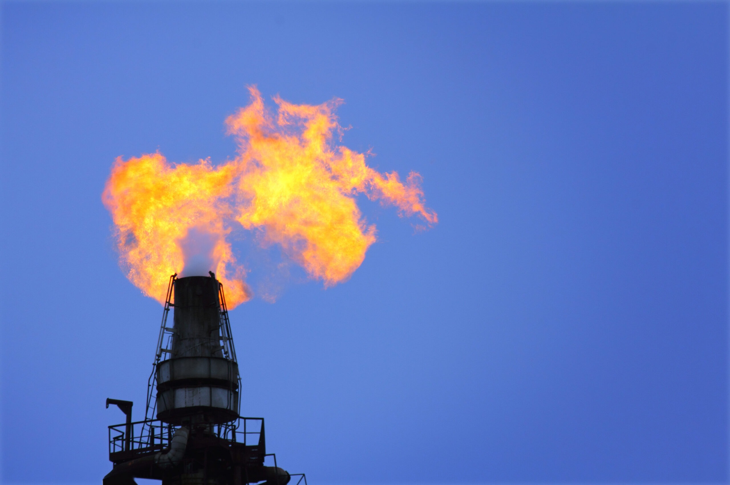 torch is lit on tower refinery - air pollution